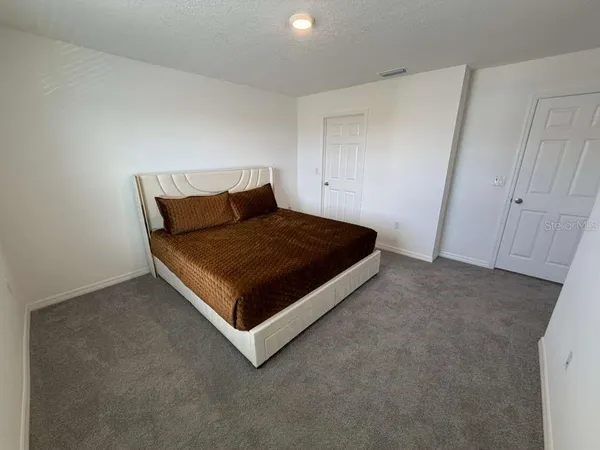 a bathroom with a sink vanity and a mirror