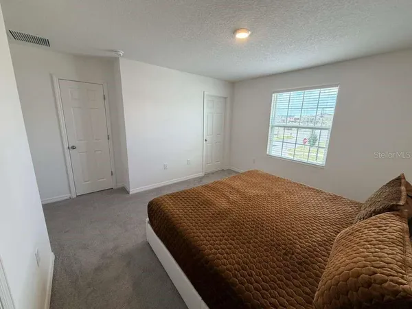 a bathroom with a sink toilet and mirror