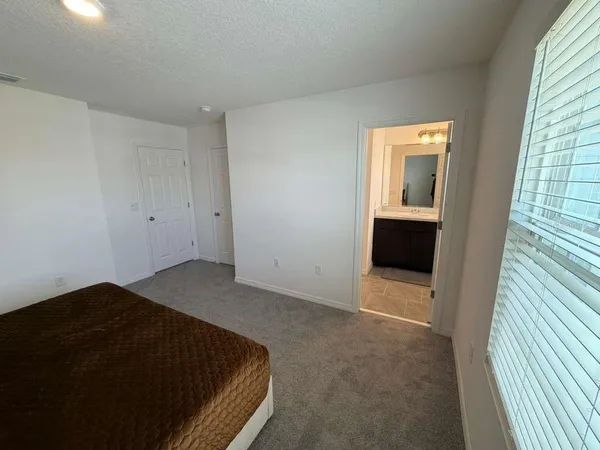 a view of a park with lots of swings and slides