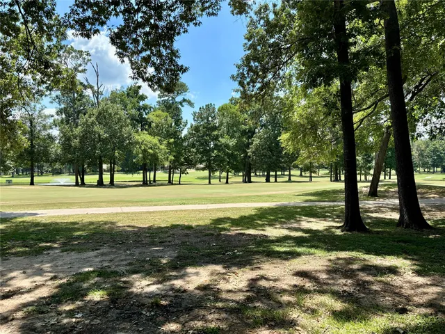 a view of a house with a yard a table and a chandelier