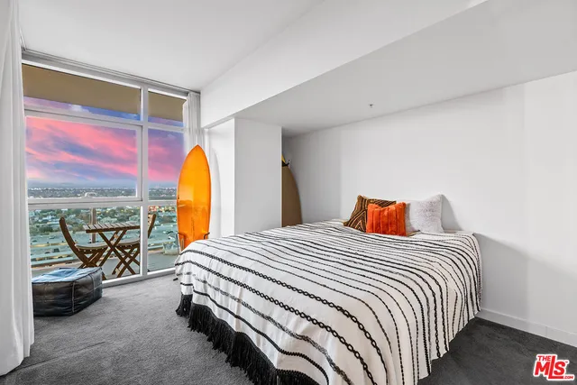 a bathroom with a granite countertop sink mirror and shower