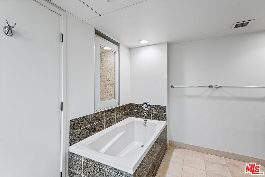 13700 Marina Pointe Drive, Unit 1520 Marina del Rey, CA 90292 - Photo 15 of 64 a bathroom with a tub and shower