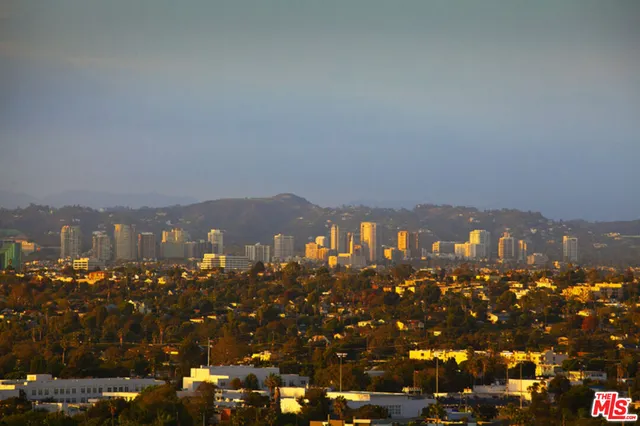 a room with furniture a flat screen tv and a faucet