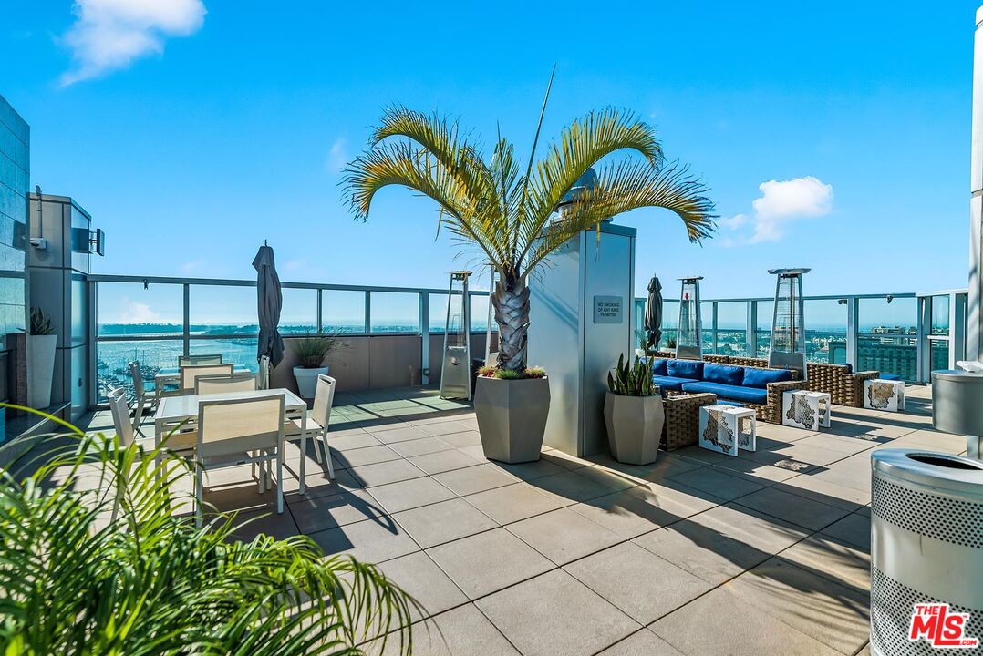 13700 Marina Pointe Drive, Unit 1520 Marina del Rey, CA 90292 - Photo 60 of 64 a view of a balcony with chairs and iron fence