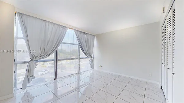 a view of livingroom with furniture and windows