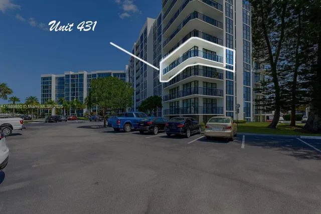 a view of a building with a yard