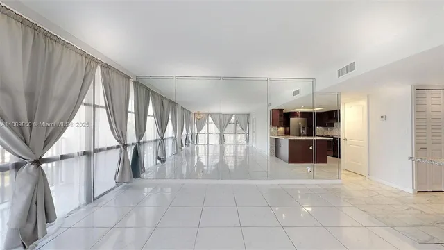 a view of entryway with a kitchen and utility room