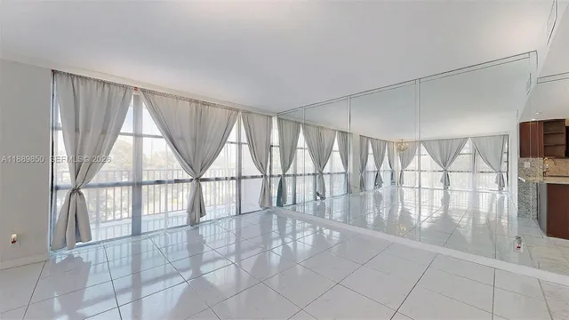 a view of a balcony with wooden floor and stairs