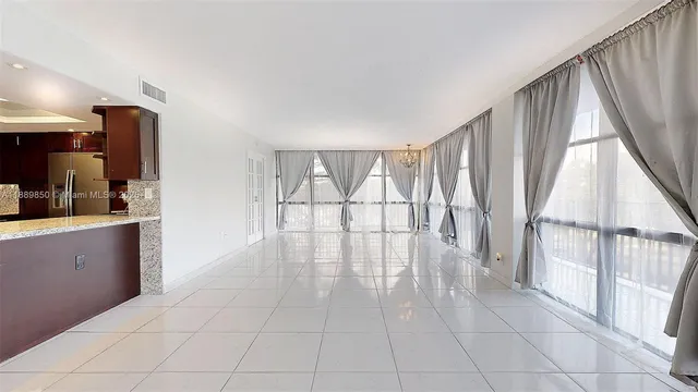 a view of an empty room and window