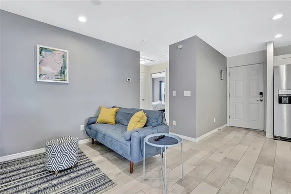 a living room with furniture and a rug