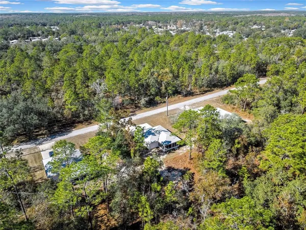 a view of a yard with an outdoor space