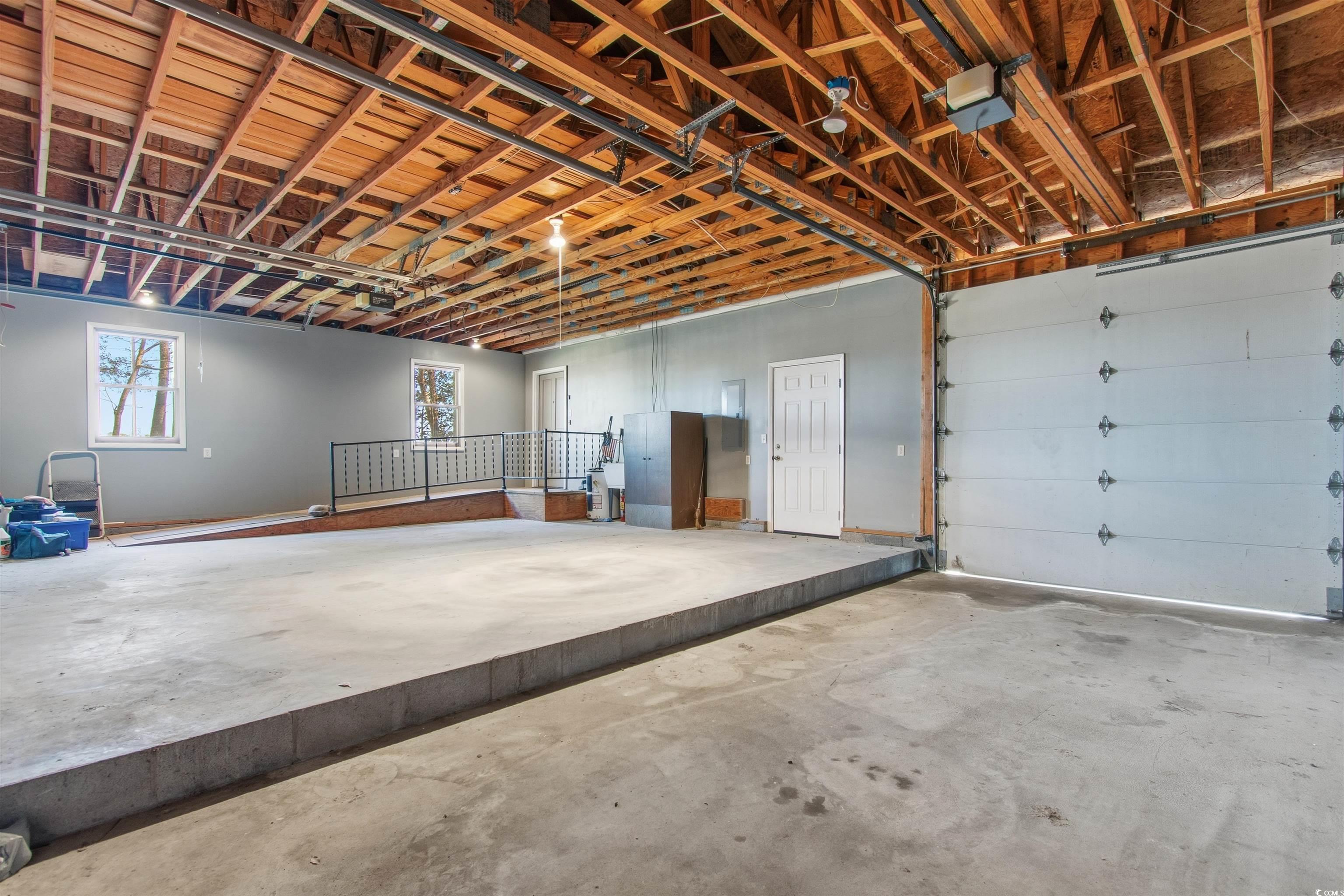 50 Irvin Enzor Road North Fair Bluff, NC 28439 - Photo 11 of 26 Garage featuring a garage door opener