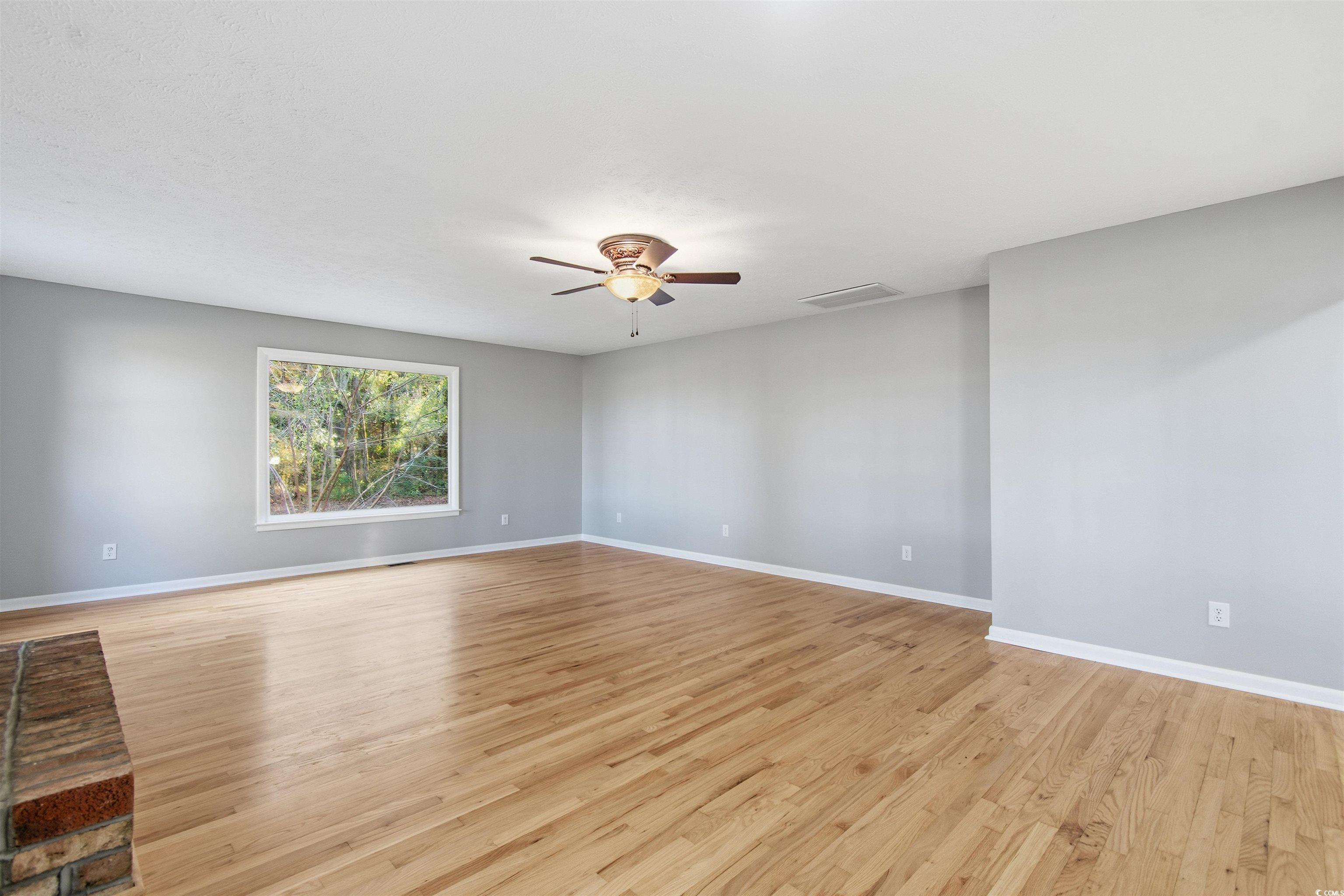50 Irvin Enzor Road North Fair Bluff, NC 28439 - Photo 13 of 26 Living room featuring hard wood floors