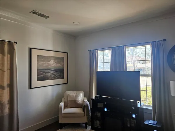 a living room with furniture and windows