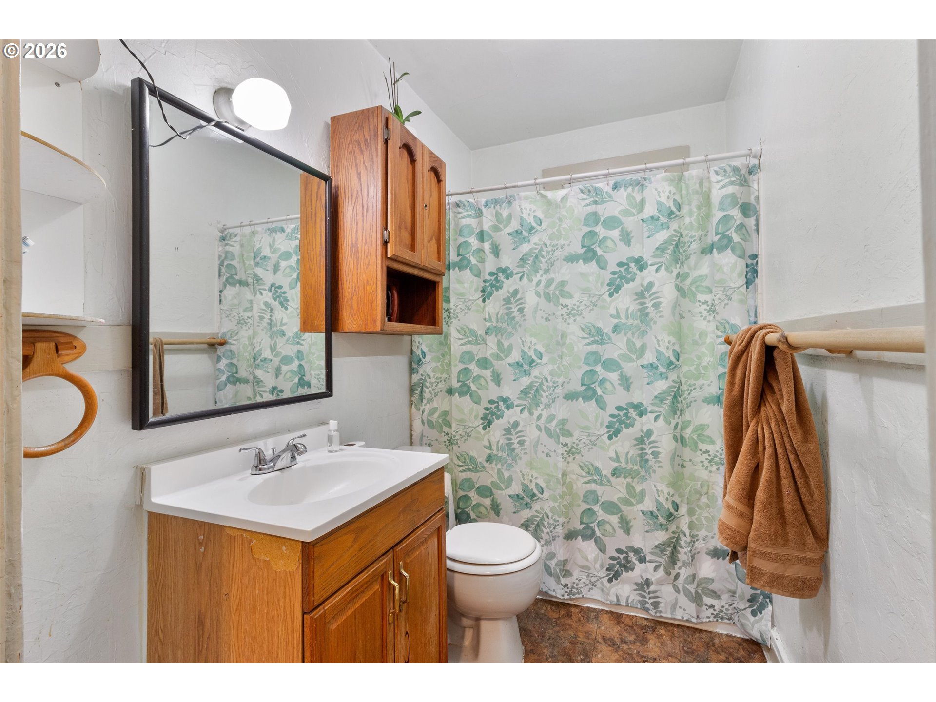 1225 West Main Street Medford, OR 97501 - Photo 19 of 45 a bathroom with a sink and a mirror