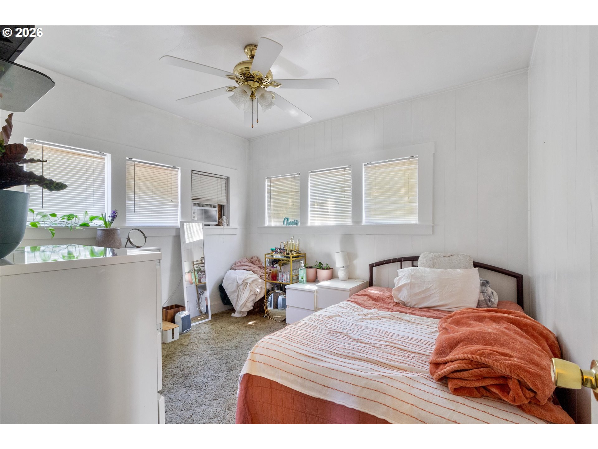 1225 West Main Street Medford, OR 97501 - Photo 20 of 45 a bedroom with a bed and ceiling fan