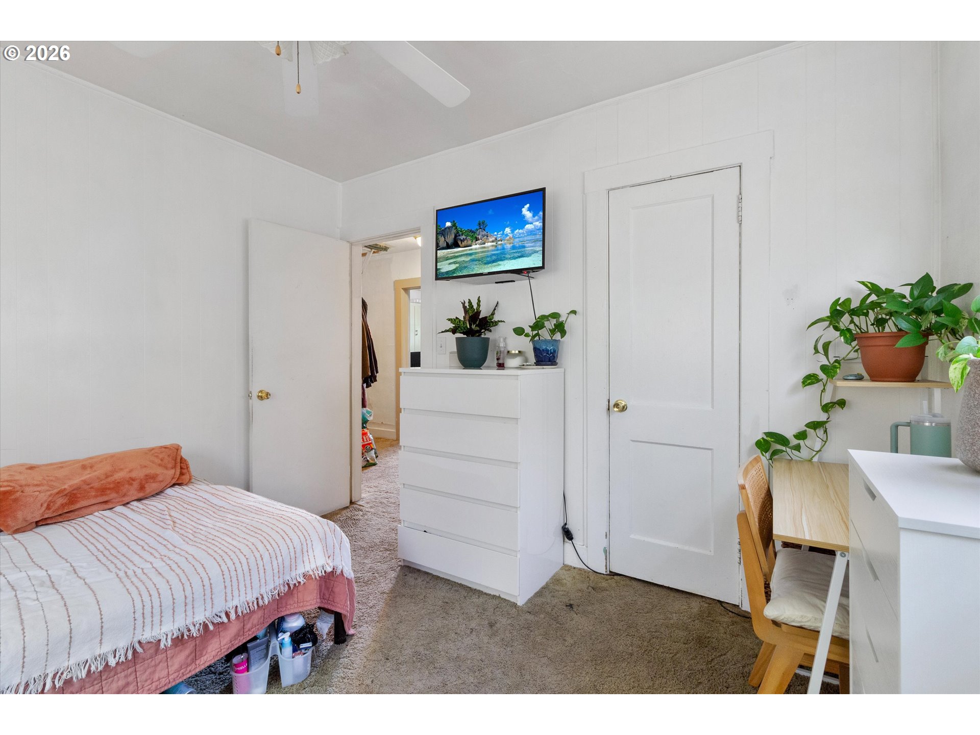 1225 West Main Street Medford, OR 97501 - Photo 21 of 45 a bedroom with a bed table and a potted plant