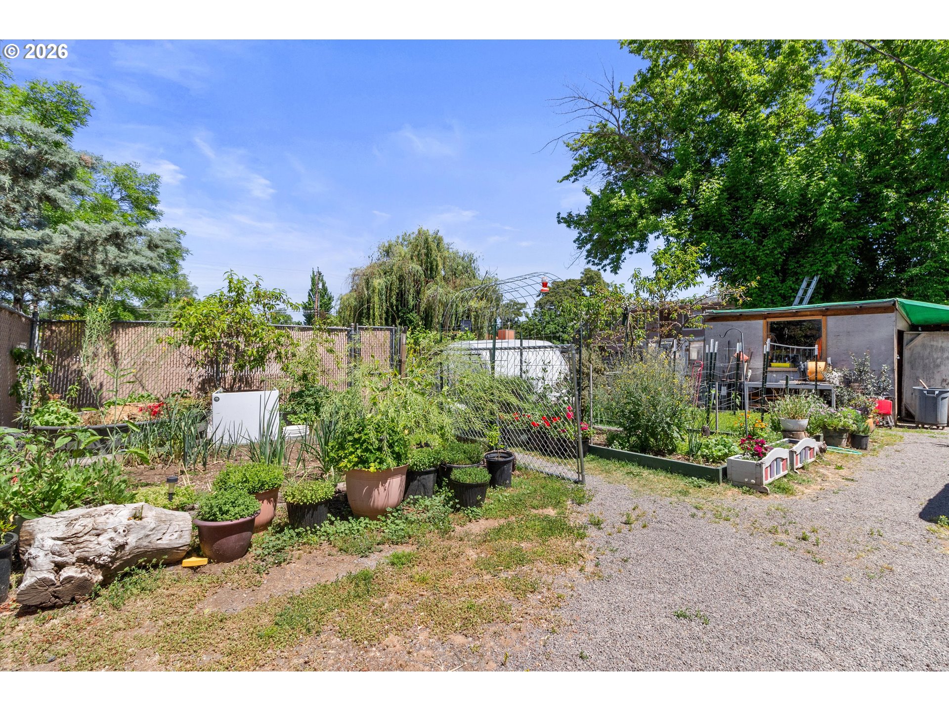 1225 West Main Street Medford, OR 97501 - Photo 23 of 45 a backyard of a house with a yard and outdoor seating