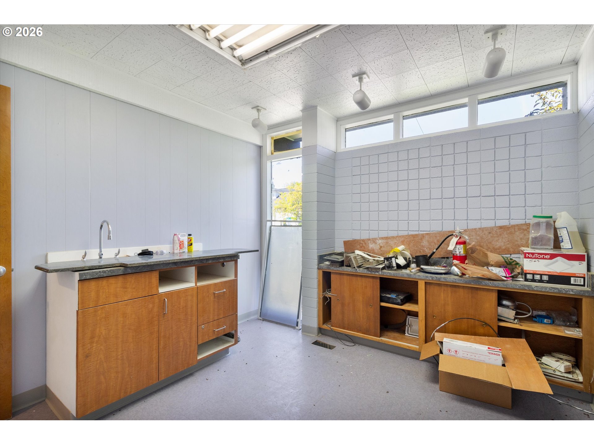 1225 West Main Street Medford, OR 97501 - Photo 30 of 45 a kitchen that has a lot of cabinets