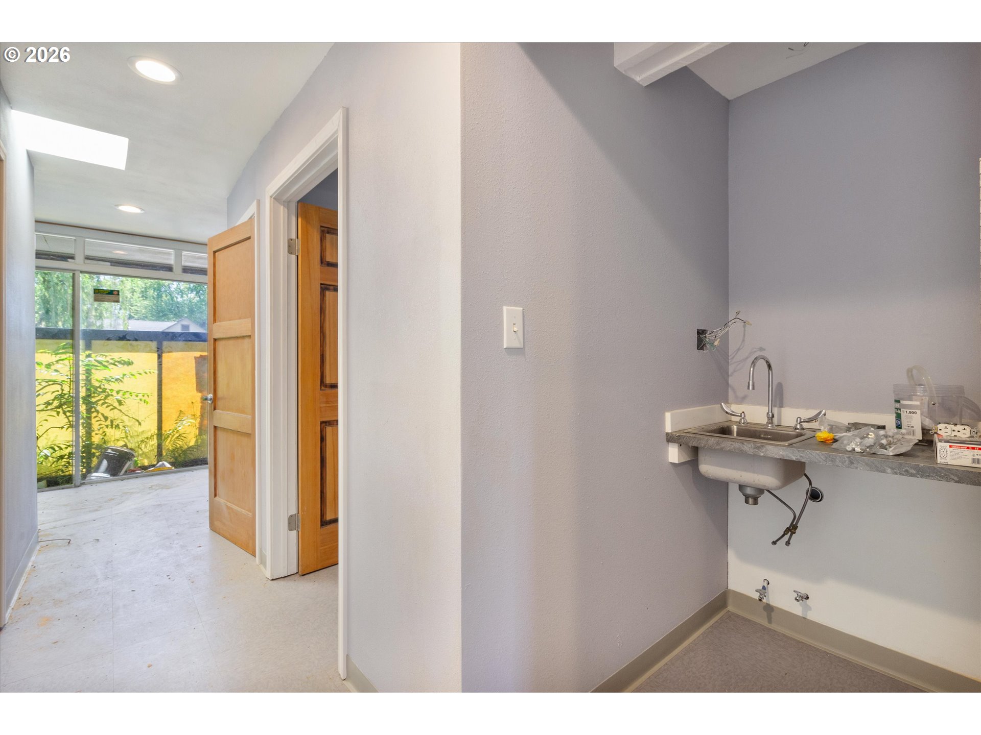 1225 West Main Street Medford, OR 97501 - Photo 33 of 45 a kitchen with a sink cabinets and appliances