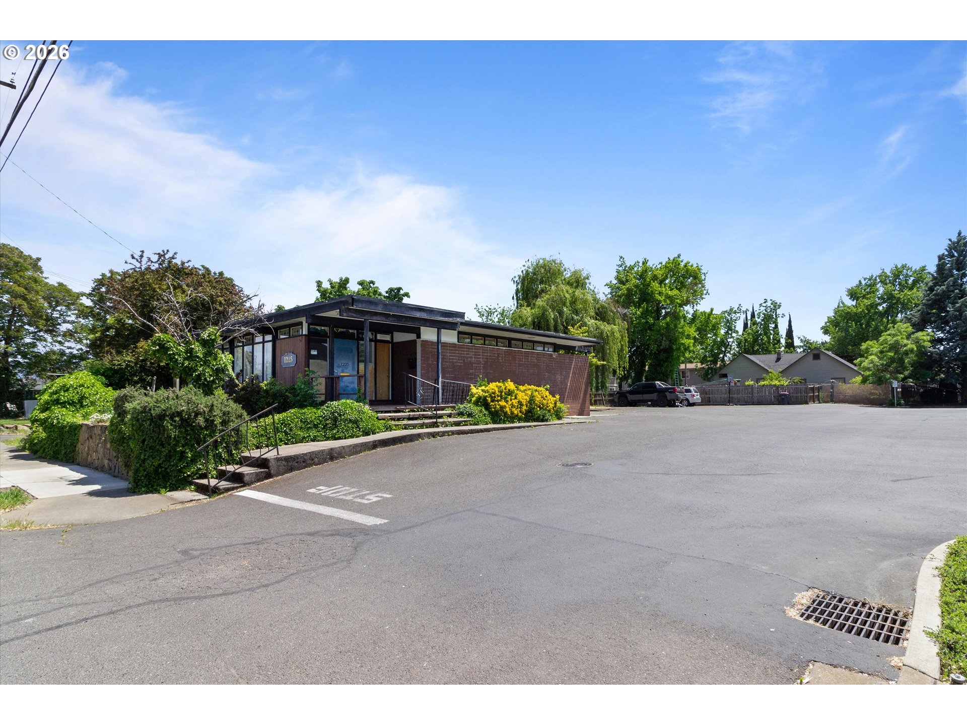 1225 West Main Street Medford, OR 97501 - Photo 4 of 45 a view of a street with a building in the background