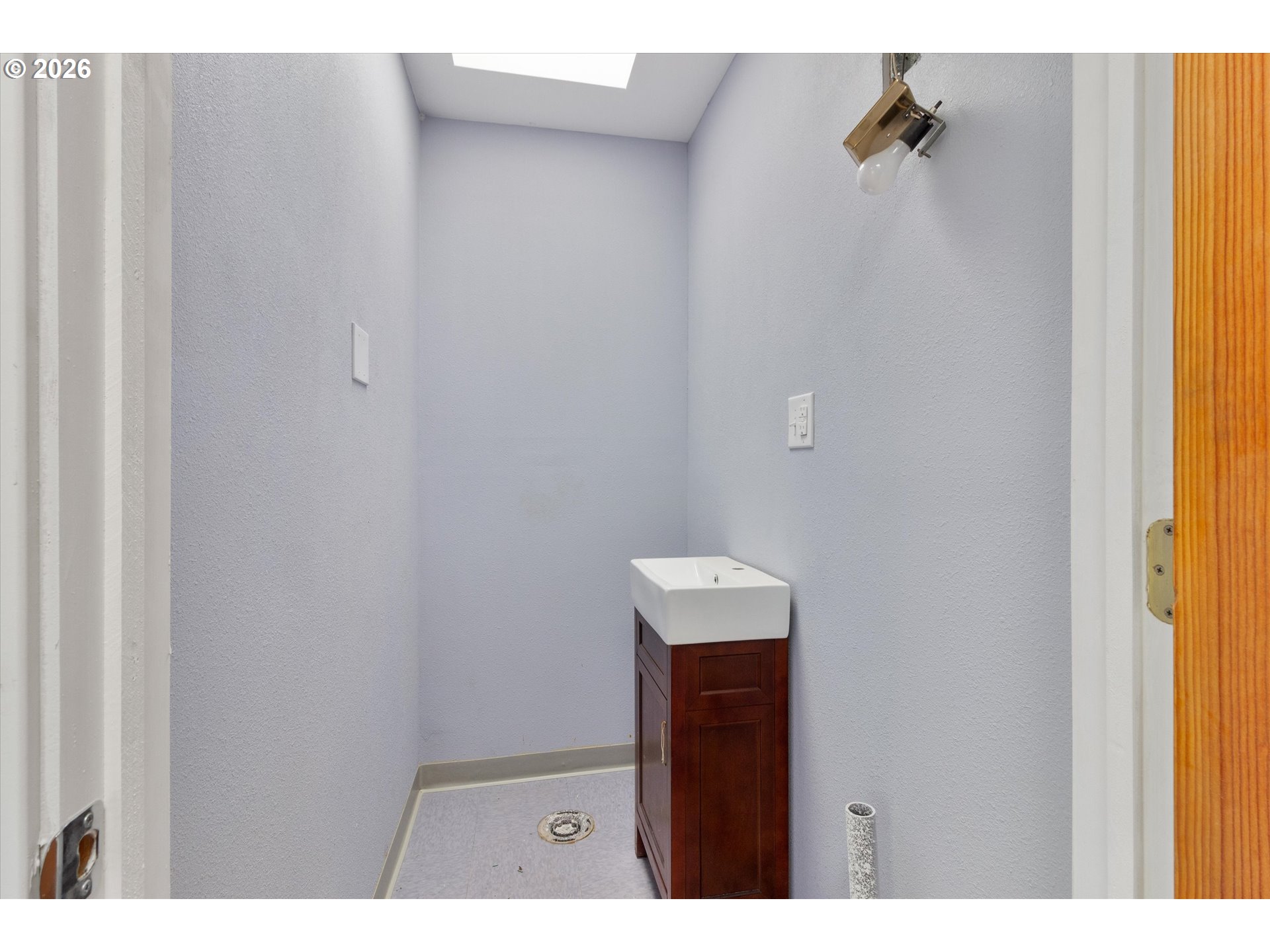 1225 West Main Street Medford, OR 97501 - Photo 43 of 45 a bathroom with a sink and mirror
