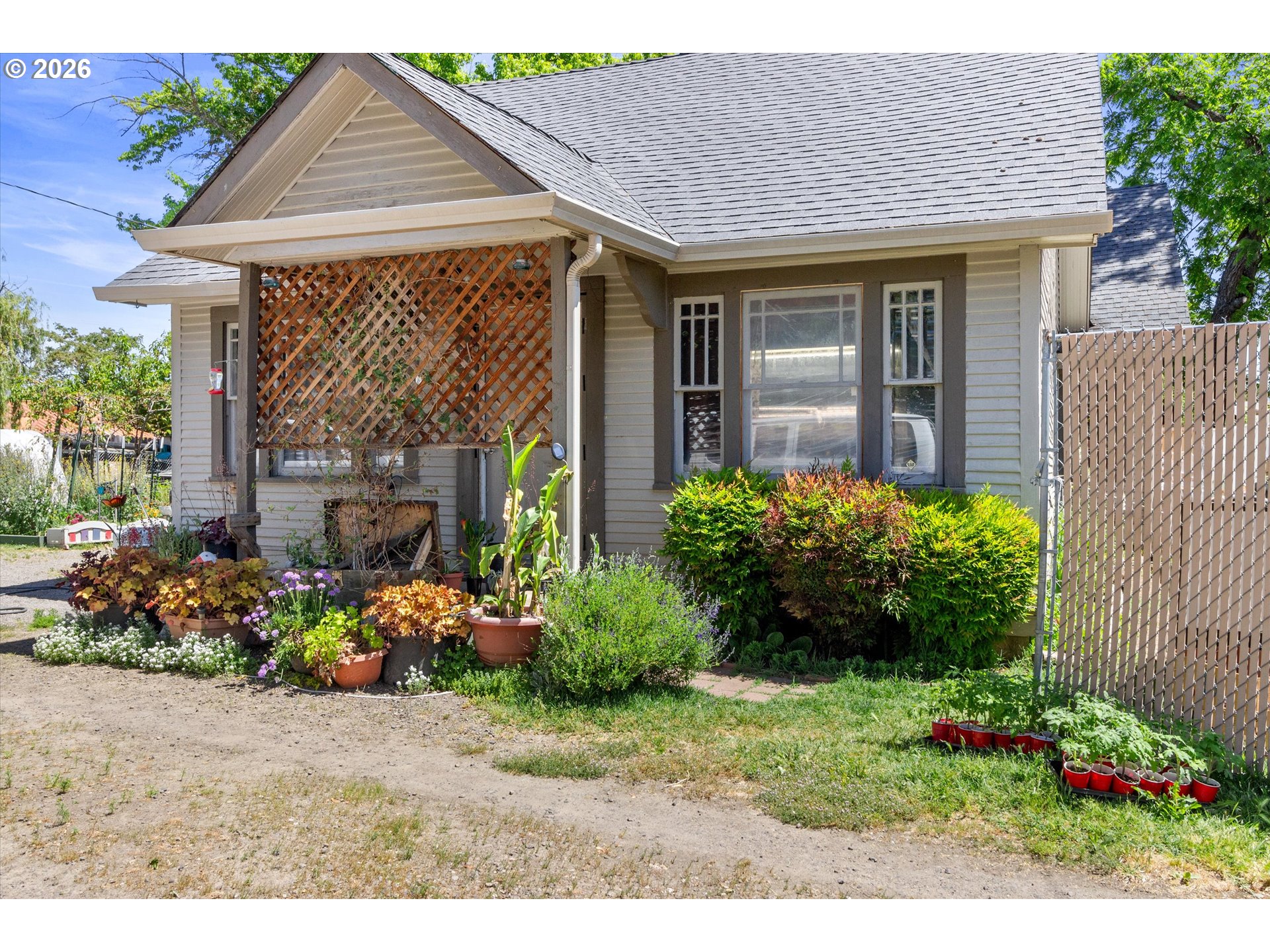 1225 West Main Street Medford, OR 97501 - Photo 5 of 45 a front view of a house with a yard