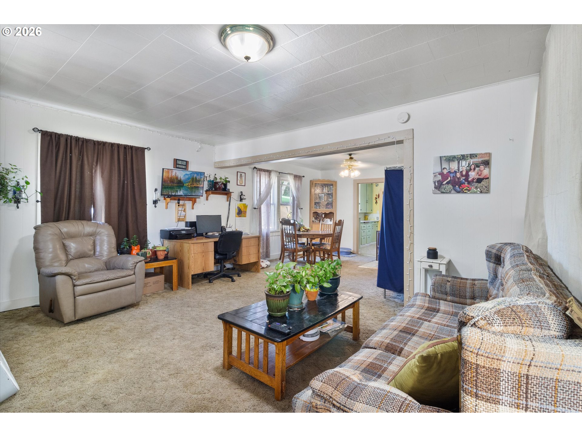 1225 West Main Street Medford, OR 97501 - Photo 7 of 45 a living room with furniture and a couch