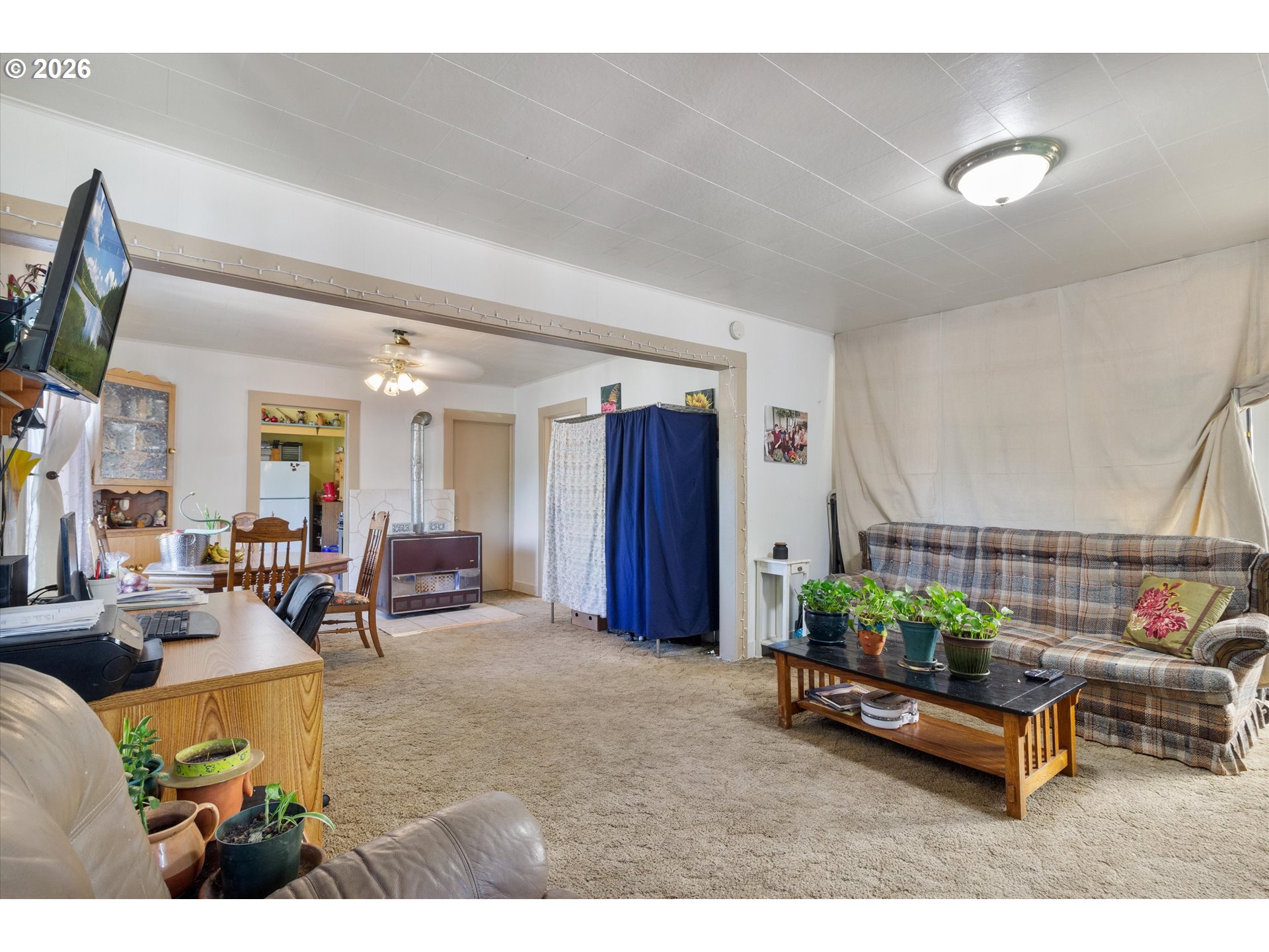 1225 West Main Street Medford, OR 97501 - Photo 8 of 45 a living room with furniture and a flat screen tv