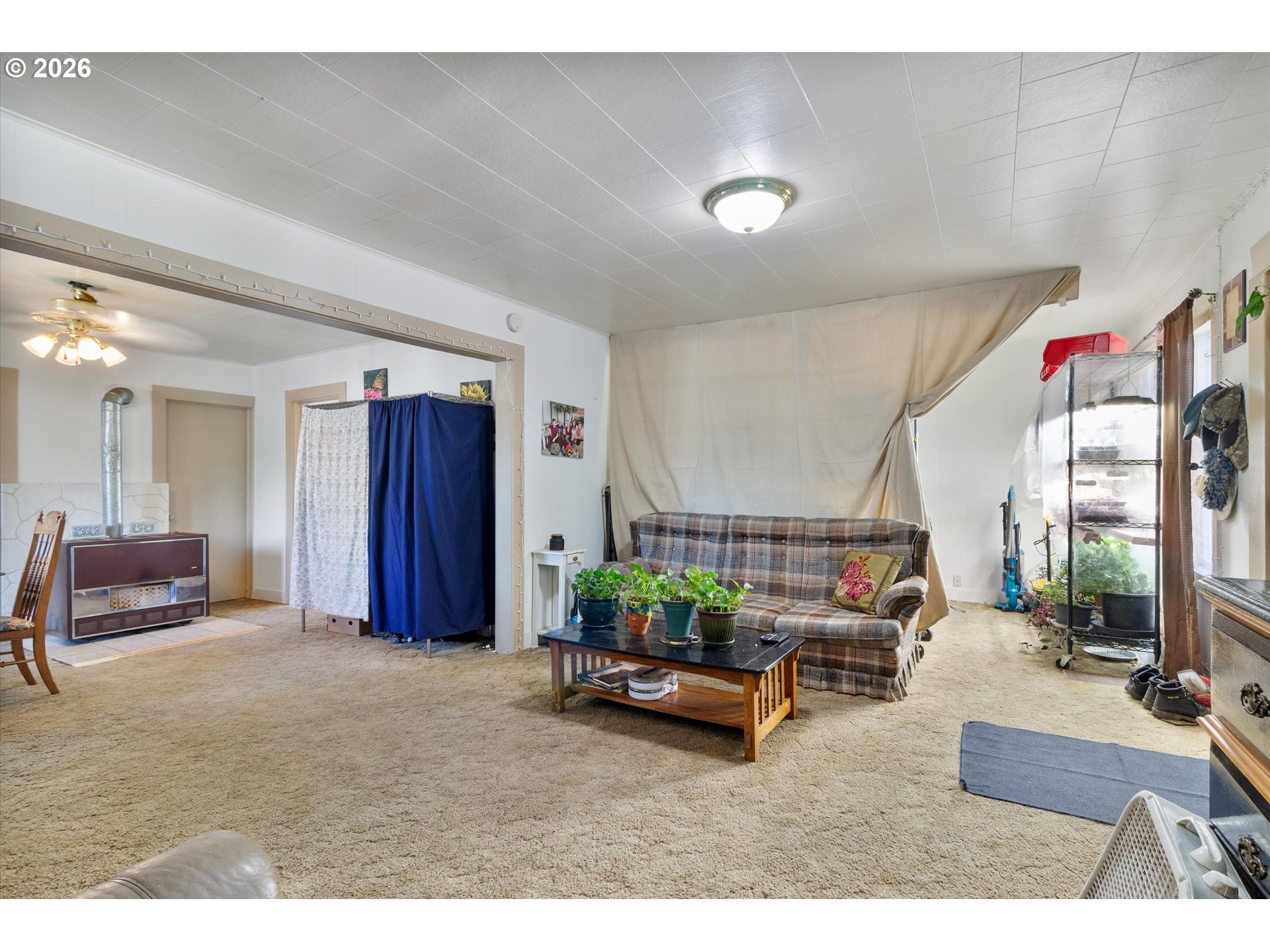 1225 West Main Street Medford, OR 97501 - Photo 9 of 45 a living room with furniture and a potted plant