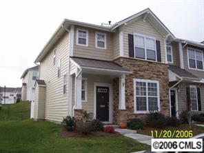930 Copperstone Lane, Unit 930 Fort Mill, SC 29708 - Photo 1 of 8 a front view of a house with garden