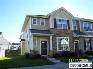 930 Copperstone Lane, Unit 930 Fort Mill, SC 29708 - Photo 2 of 8 a front view of a house with a yard