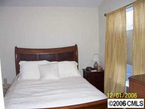 930 Copperstone Lane, Unit 930 Fort Mill, SC 29708 - Photo 7 of 8 a bedroom with a bed and a window