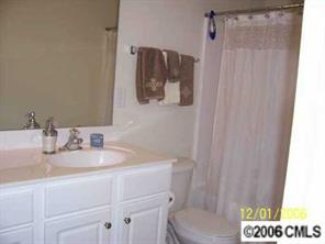 930 Copperstone Lane, Unit 930 Fort Mill, SC 29708 - Photo 8 of 8 a bathroom with a sink toilet and mirror