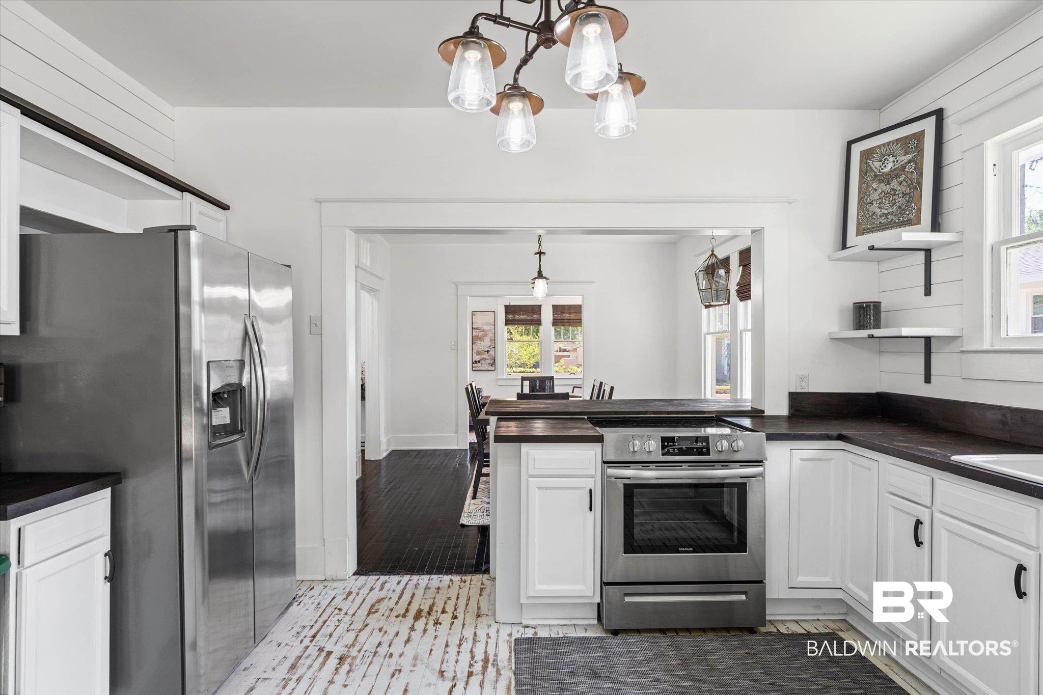 121 North Carlen Street Mobile, AL 36607 - Photo 8 of 21 Kitchen with stainless steel appliances, open shelves, white cabinets, a peninsula, and suspended lighting