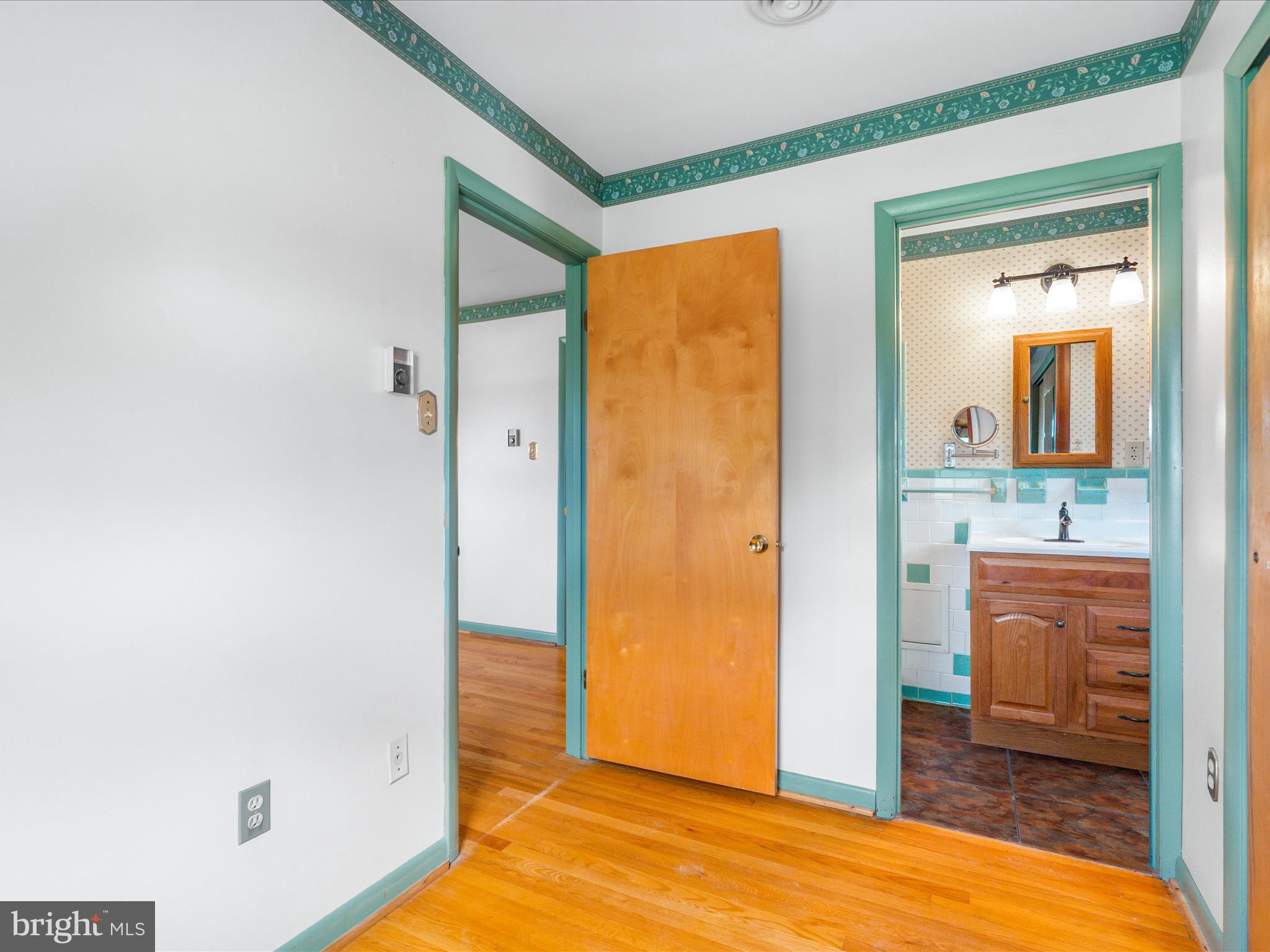4514 Araby Church Road Frederick, MD 21704 - Photo 26 of 89 a view of a hallway with bathroom and wooden floor