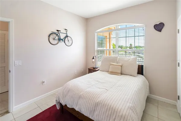 an aerial view of a house with a garden and lake view