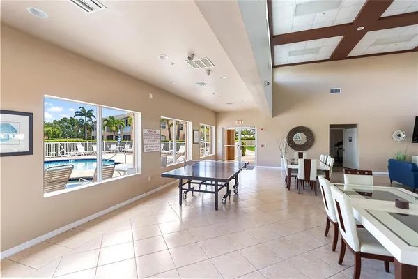 a view of a swimming pool with outdoor seating