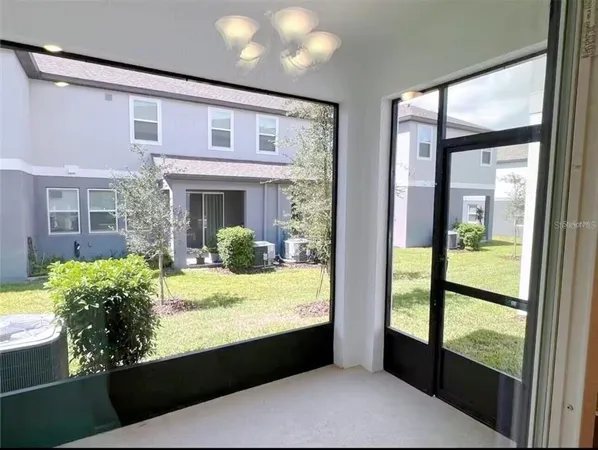 a living room with large windows
