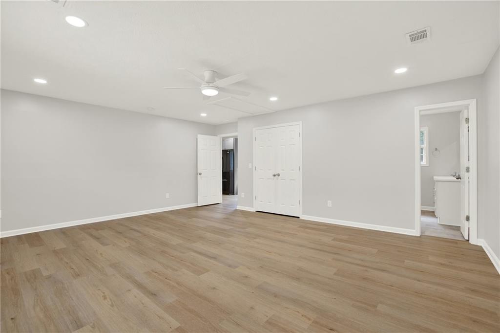 76 Picklesimer Road Southwest Cartersville, GA 30120 - Photo 17 of 43 a view of an empty room with wooden floor