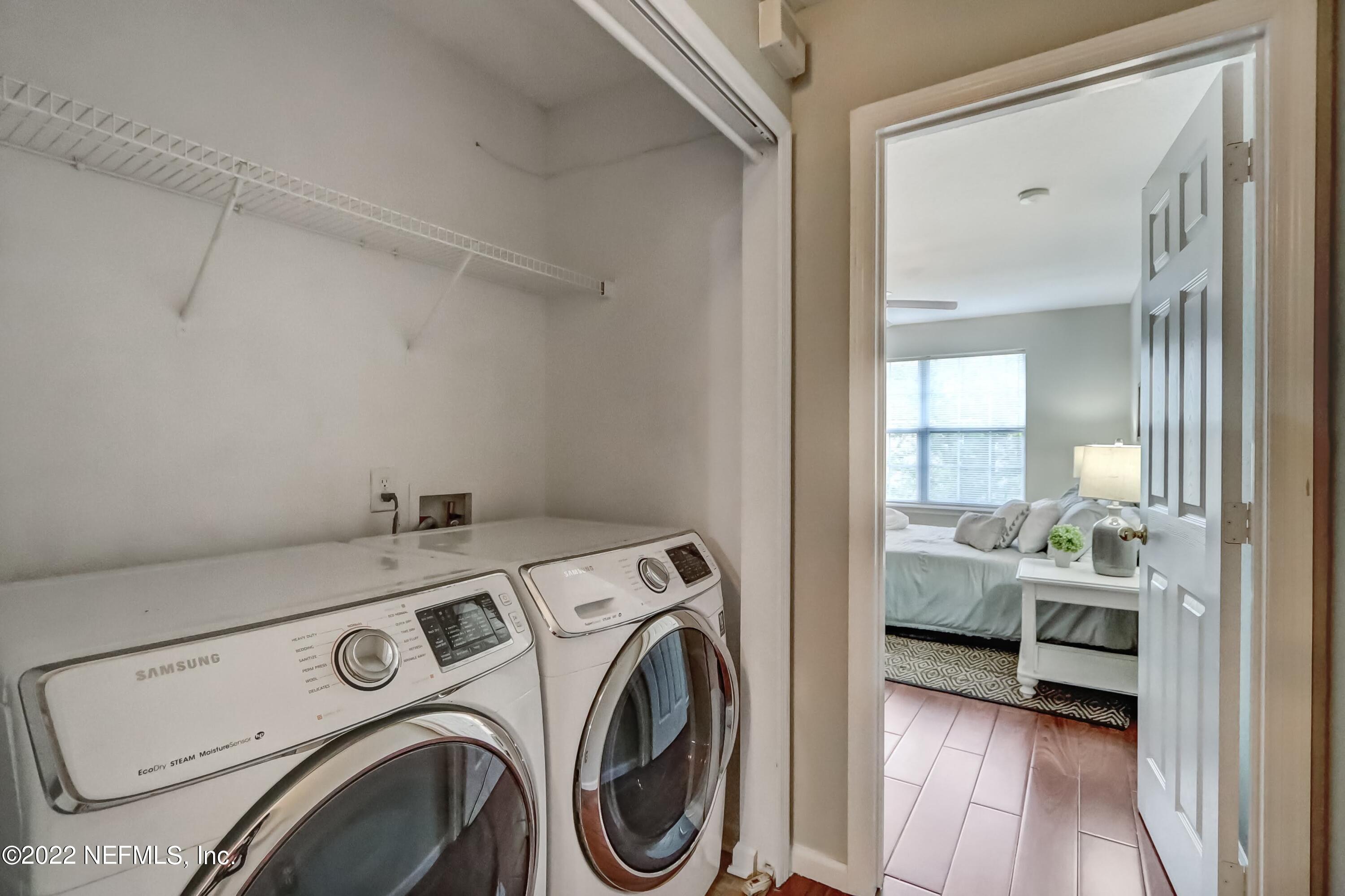 6849 Misty View Drive Jacksonville, FL 32210 - Photo 12 of 21 a view of storage and utility room with washer and dryer