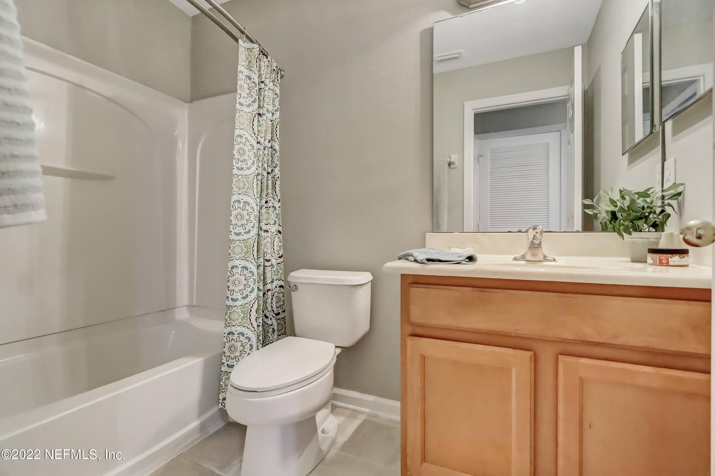 6849 Misty View Drive Jacksonville, FL 32210 - Photo 19 of 21 a bathroom with a sink a toilet and shower