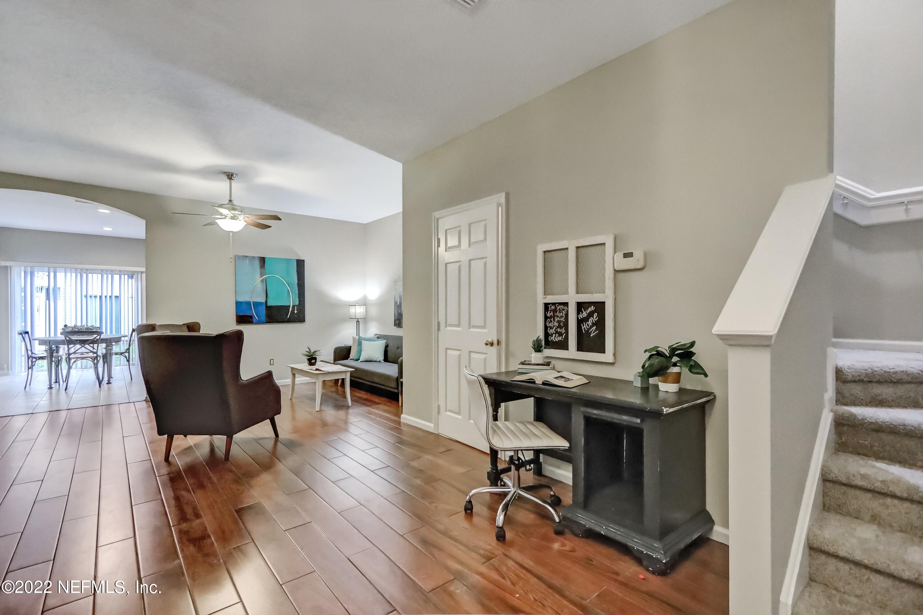 6849 Misty View Drive Jacksonville, FL 32210 - Photo 3 of 21 a view of a livingroom with furniture and a kitchen