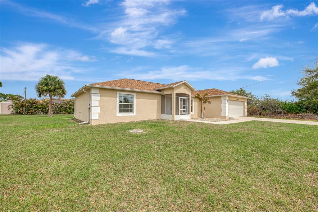 12462 Buffing Road Port Charlotte, FL 33981 - Photo 1 of 1 a view of a house with a yard
