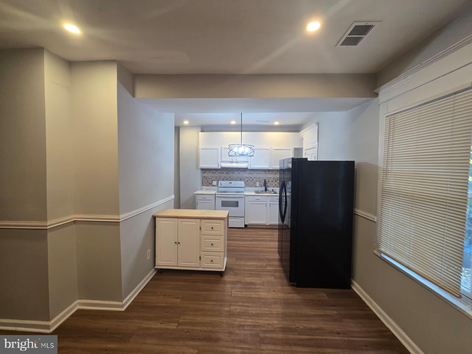 2430 Reisterstown Road Baltimore, MD 21217 - Photo 13 of 40 a kitchen with appliances and cabinets