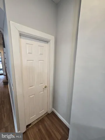 an empty room with wooden floor