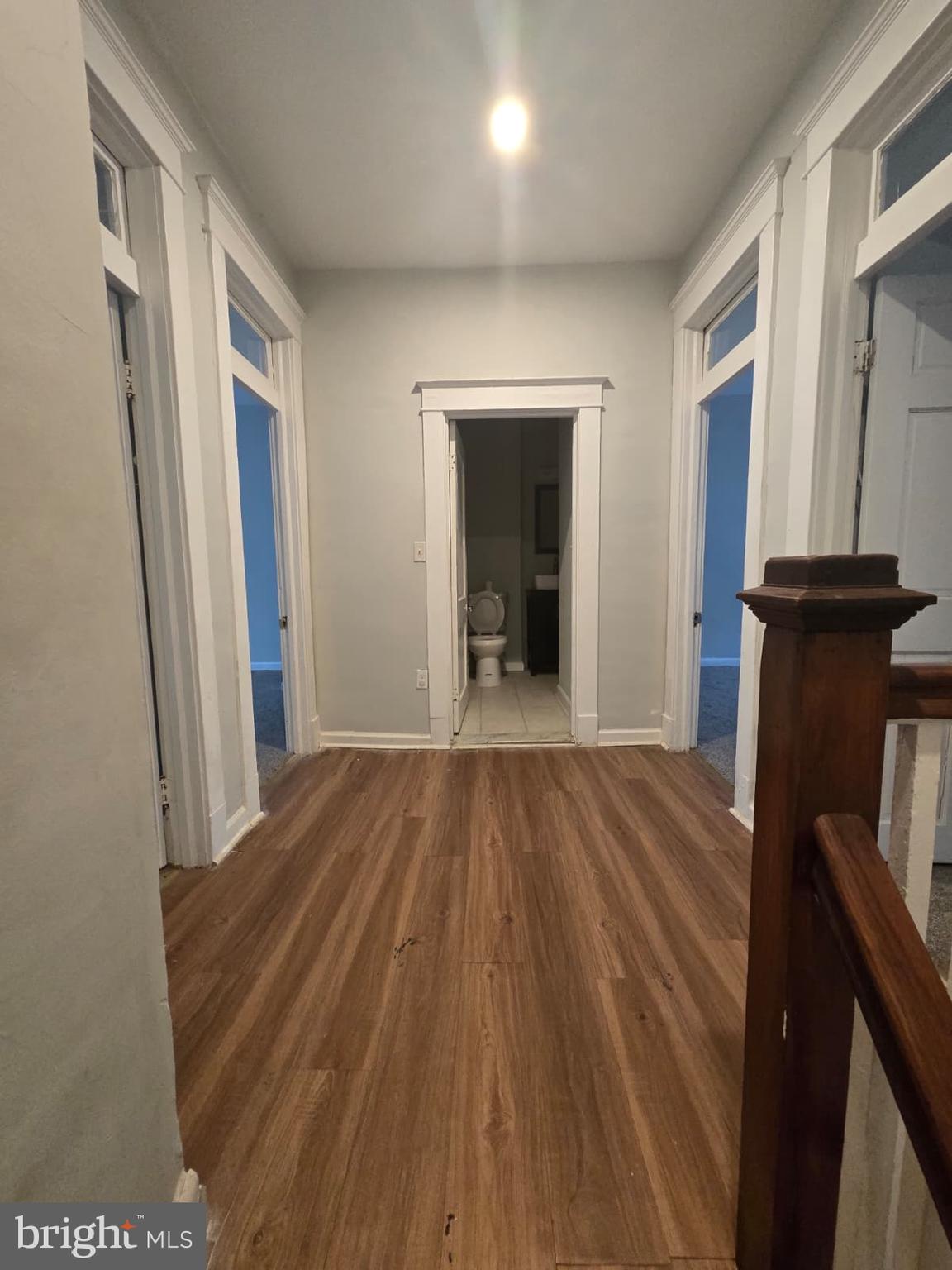 2430 Reisterstown Road Baltimore, MD 21217 - Photo 18 of 40 a view of a hallway with wooden floor and staircase