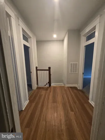 a view of entryway with wooden floor