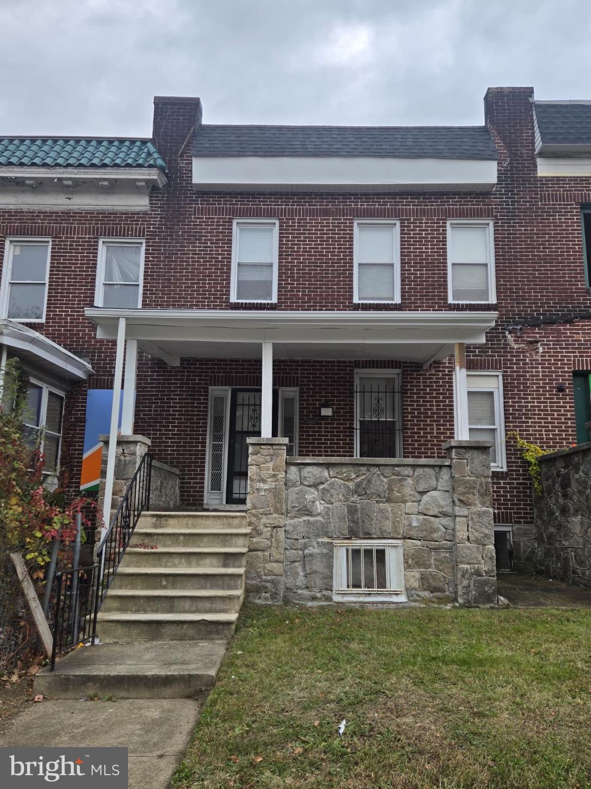 2430 Reisterstown Road Baltimore, MD 21217 - Photo 2 of 40 a front view of a house with a garden