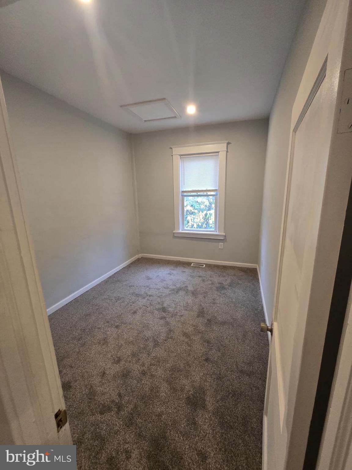 2430 Reisterstown Road Baltimore, MD 21217 - Photo 22 of 40 an empty room with windows